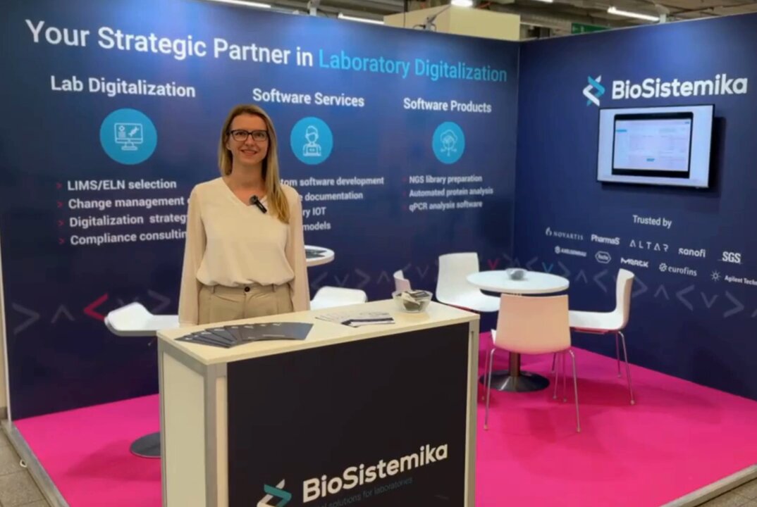 image of brand biosistemika lead erstanding behind counter in expo event