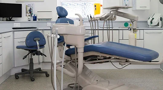 image of st raphael dental clinic room full of equipment laying chair and devices etc